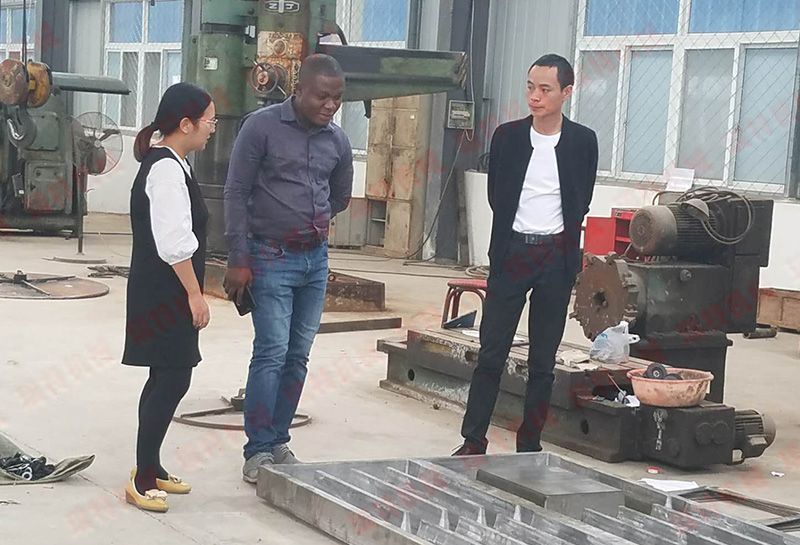 A Ghanaian customer came to our company to order a slatted floor production line